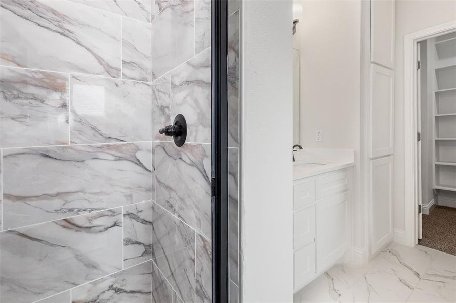 Separate tiled shower in Primary Bath.