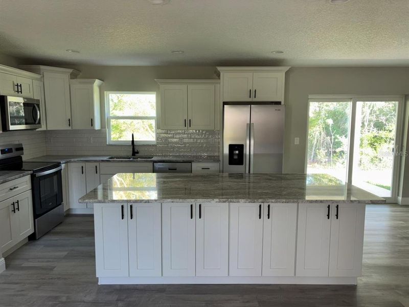 Furnished interior view inside a new home in , Dunnellon (Image 8).