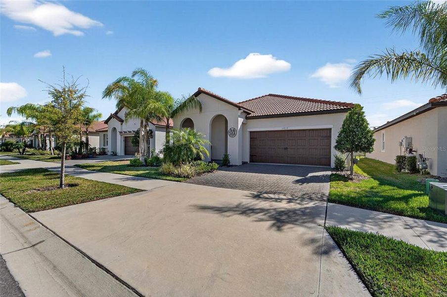 Front exterior of a new home in Southshore Bay Active Adult, Wimauma, FL, highlighting curb appeal (Image 25).