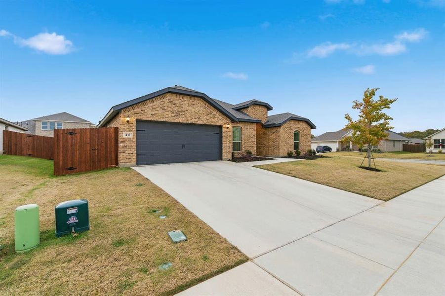 Front exterior of a new home in , Azle, TX, highlighting curb appeal (Image 2).