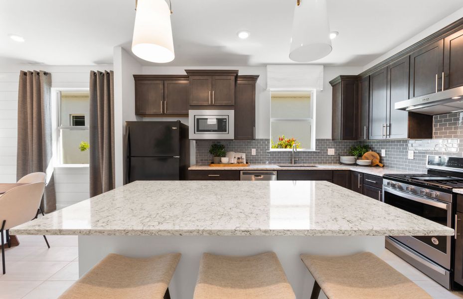 Representative furnished interior of a home built from the Contour by DiVosta in BeachWalk by Manasota Key, Englewood (Image 10). Representative furnished interior of a home built from the Contour by DiVosta in BeachWalk by Manasota Key, Englewood (Image 10).