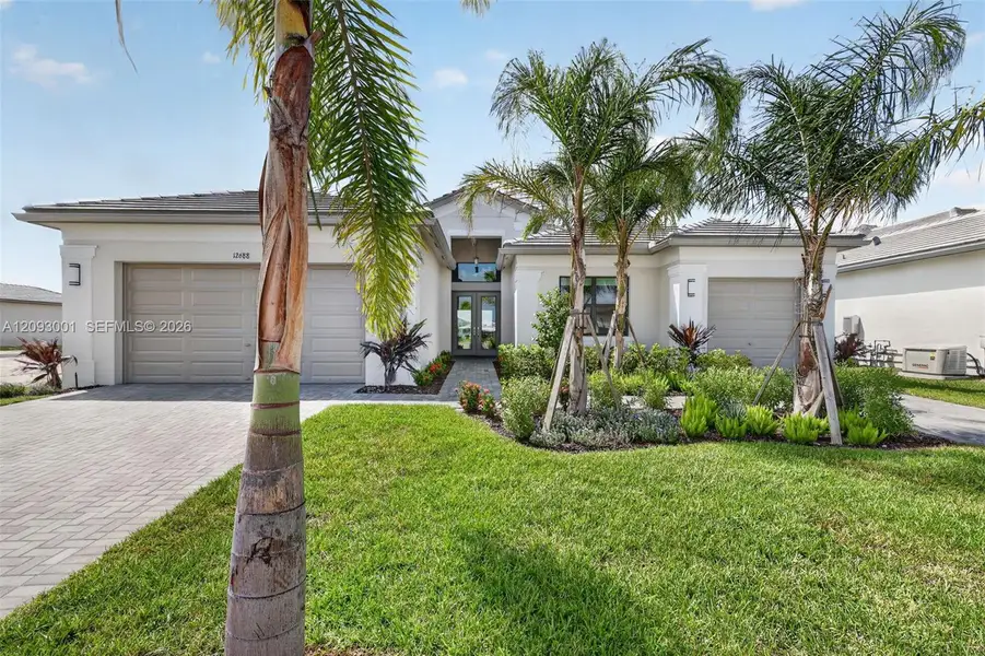 Front exterior of a new home in , Port St. Lucie, FL, highlighting curb appeal (Image 2). Front exterior of a new home in , Port St. Lucie, FL, highlighting curb appeal (Image 2).