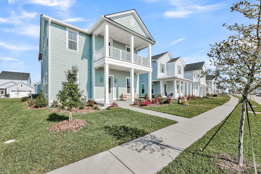 Front exterior of a new home in Carnes Crossroads, Summerville, SC, highlighting curb appeal (Image 23).