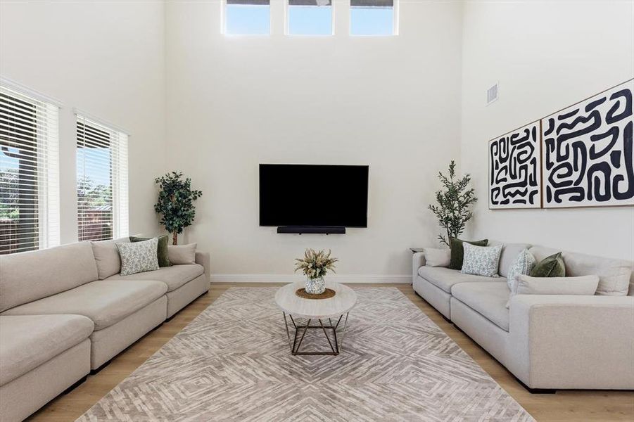 Vaulted ceiling Family room featuring plenty of natural light, an open feeling with multiple windows