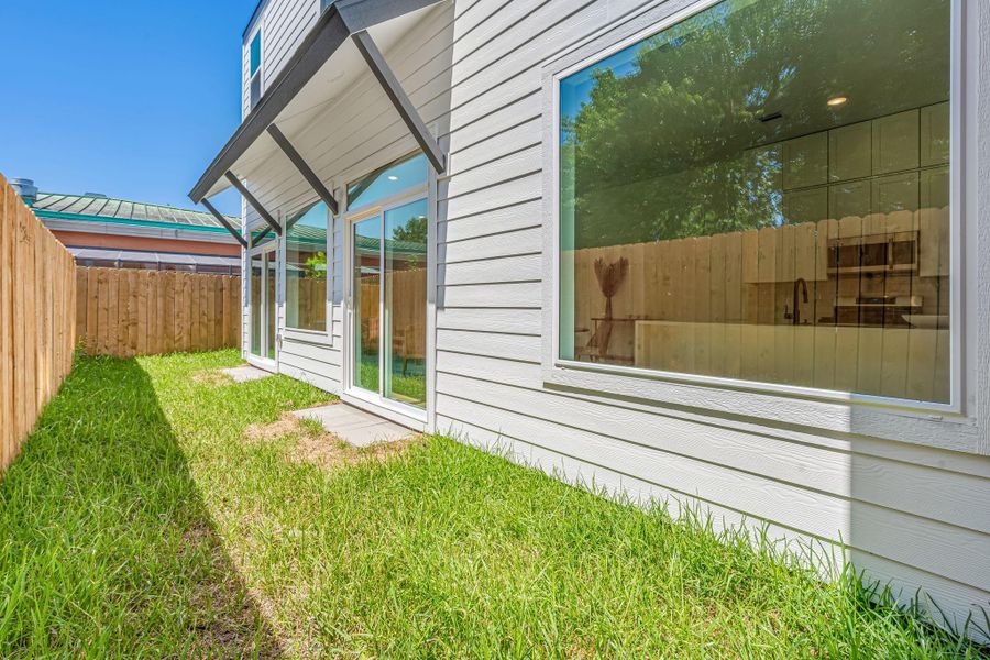 Exterior details and patio area of a home in , Houston (Image 3).