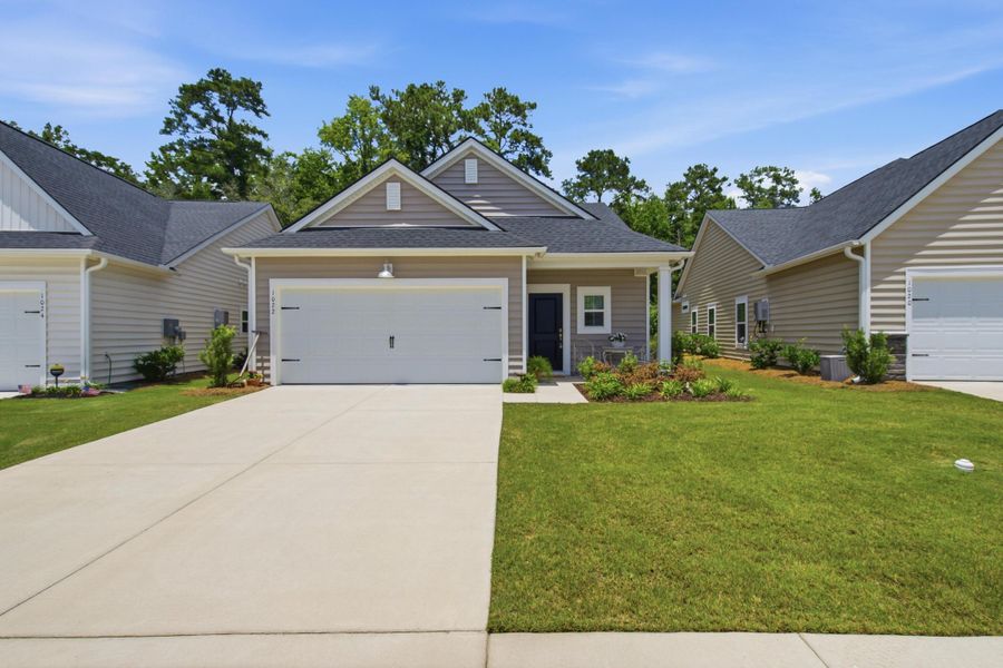 Front exterior of a new home in Horizons at Summers Corner | 55+, Summerville, SC, highlighting curb appeal (Image 22).