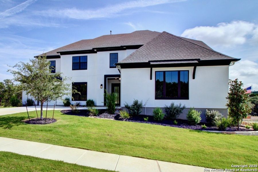 Front exterior of a new home in Verandas at the Rim, San Antonio, TX, highlighting curb appeal (Image 25).