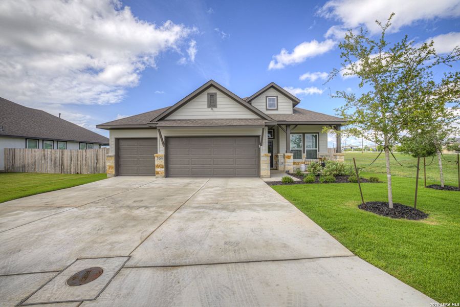 Front exterior of a new home in August Fields, New Braunfels, TX, highlighting curb appeal (Image 23).