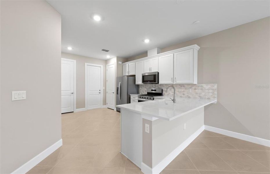 Furnished interior view inside a new home in BeachWalk by Manasota Key, Englewood (Image 9).
