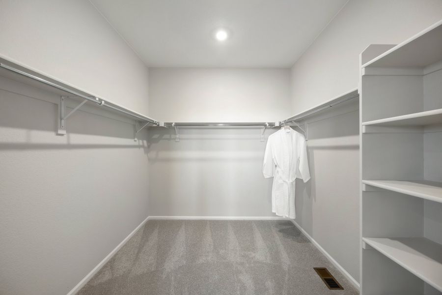 Representative unfurnished interior of a home built from the 2503 by Risewell Homes in Harvest Crossing, Aurora (Image 22).
