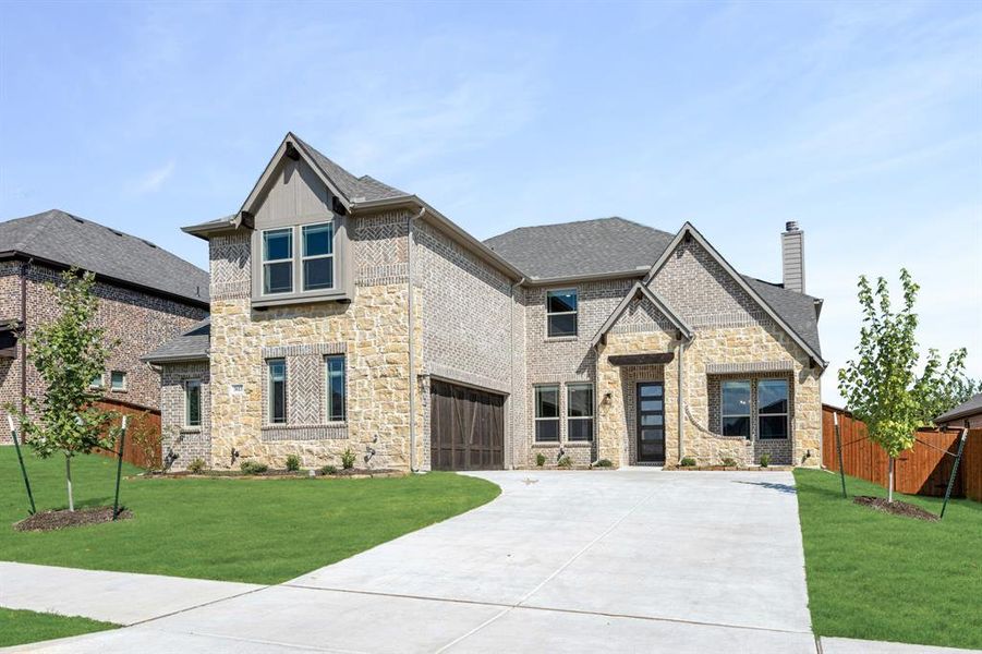 Front exterior of a new home in The Grove, Midlothian, TX, highlighting curb appeal (Image 1).