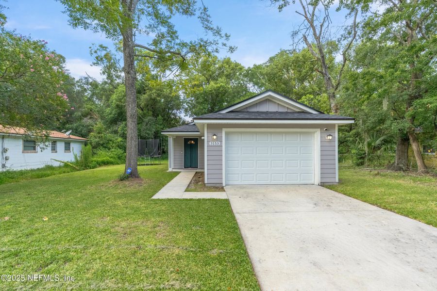 Front exterior of a new home in , Jacksonville, FL, highlighting curb appeal (Image 18).