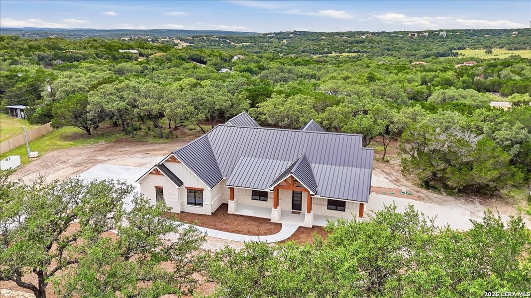 Front exterior of a new home in , Canyon Lake, TX, highlighting curb appeal (Image 24).