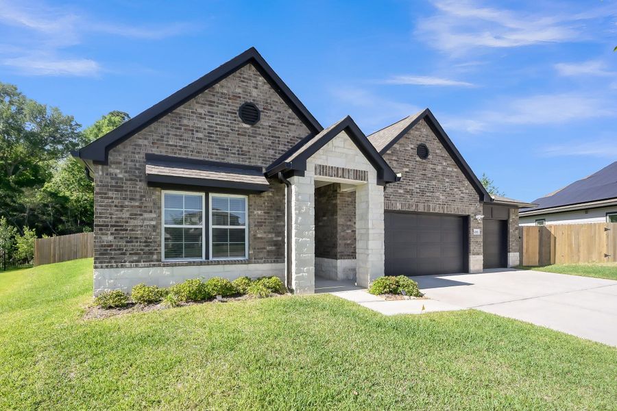 Front exterior of a new home in Lexington Heights, Willis, TX, highlighting curb appeal (Image 23).