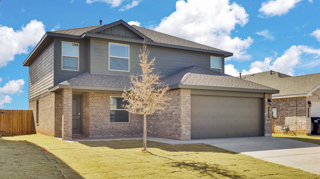 Front exterior of a new home in Overlook West, Wolfforth, TX, highlighting curb appeal (Image 14).