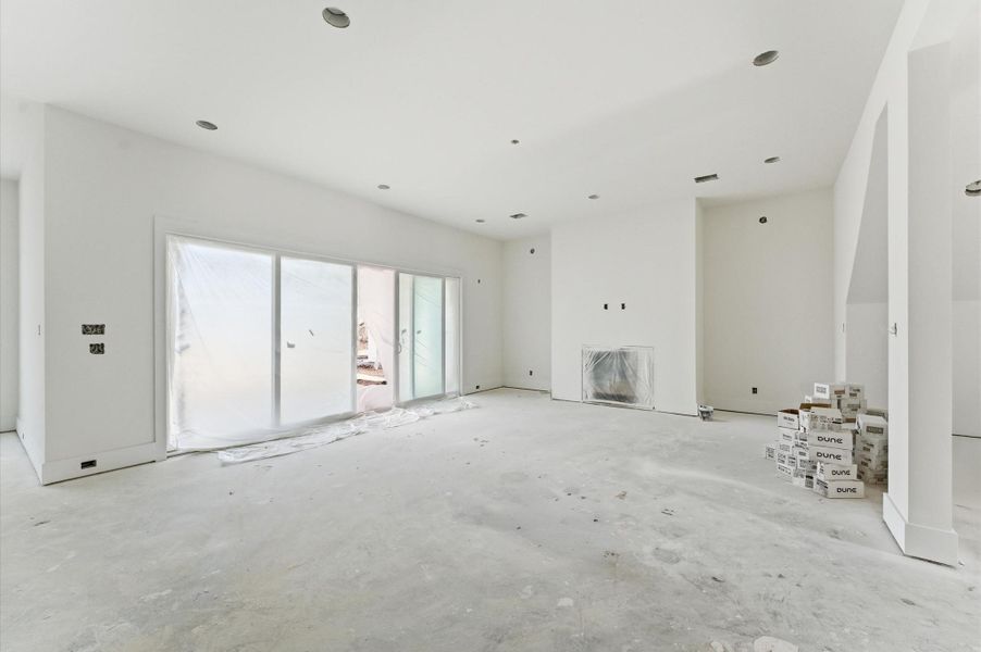 The sliding glass doors lead to the 23 ft x 9 ft covered patio.