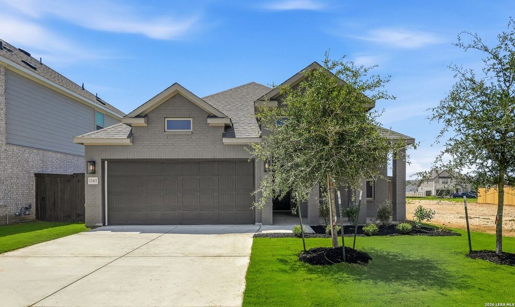 Front exterior of a new home in Bison Ridge, San Antonio, TX, highlighting curb appeal (Image 2). Front exterior of a new home in Bison Ridge, San Antonio, TX, highlighting curb appeal (Image 2).