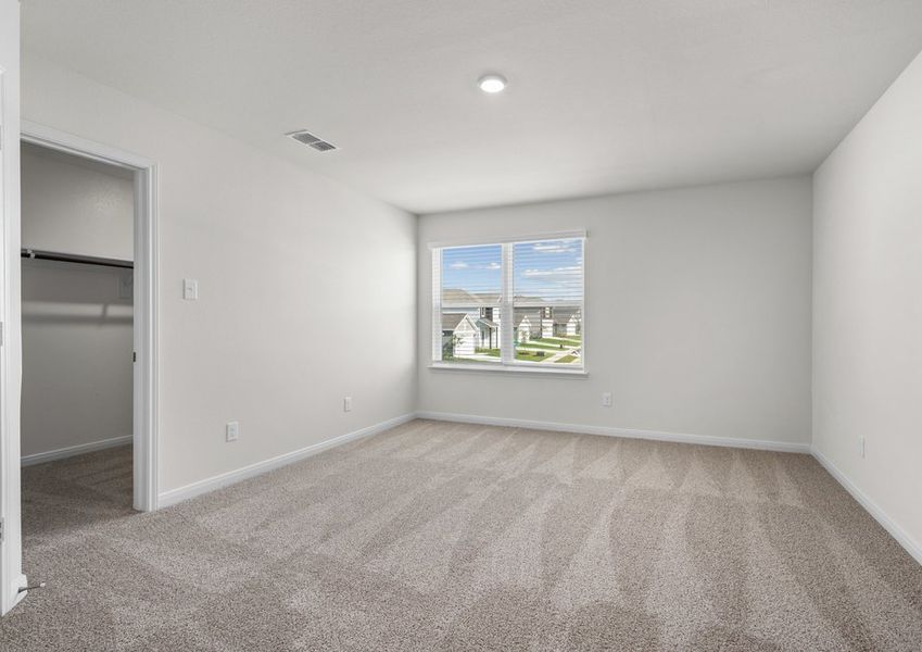 The master bedroom has a large window that lets in great, natural light.