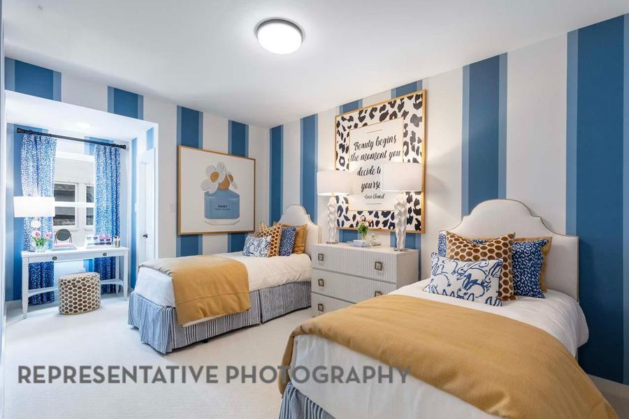 Carpeted bedroom with wallpapered walls Carpeted bedroom with wallpapered walls