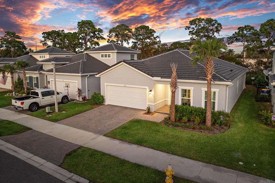 Front exterior of a new home in Banyan Bay, Stuart, FL, highlighting curb appeal (Image 24).
