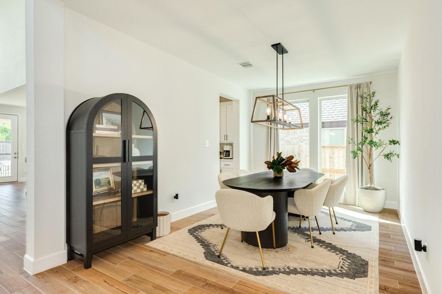 Formal Dining area featuring seamless access to the gourmet kitchen, conveniently connected by a spacious walk-in pantry Formal Dining area featuring seamless access to the gourmet kitchen, conveniently connected by a spacious walk-in pantry