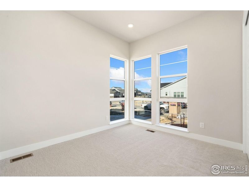 Spacious, unfurnished interior of a new home in Festival at RainDance, Windsor (Image 12).