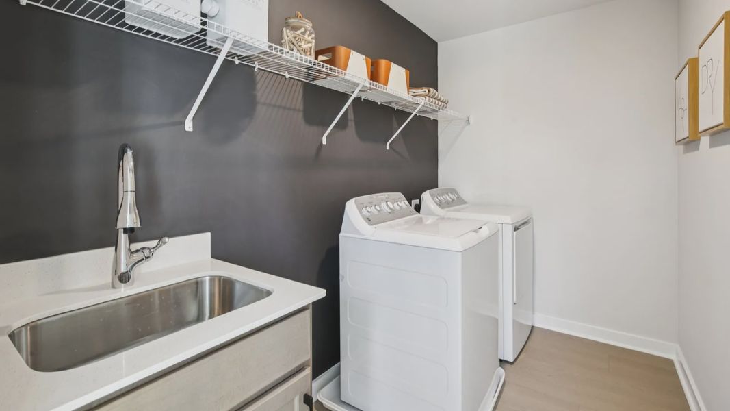 Dedicated laundry room with ventilated shelf