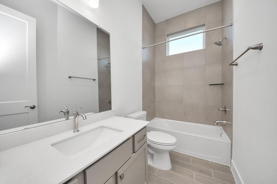 Furnished interior view inside a new home in Meridiana, Manvel (Image 11).