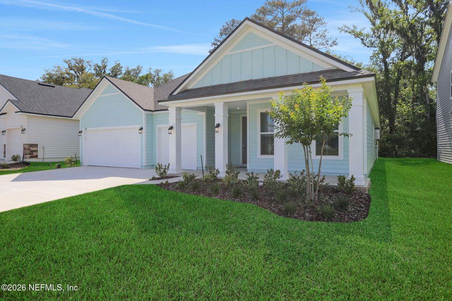 Front exterior of a new home in Jennings Farm, Middleburg, FL, highlighting curb appeal (Image 20).