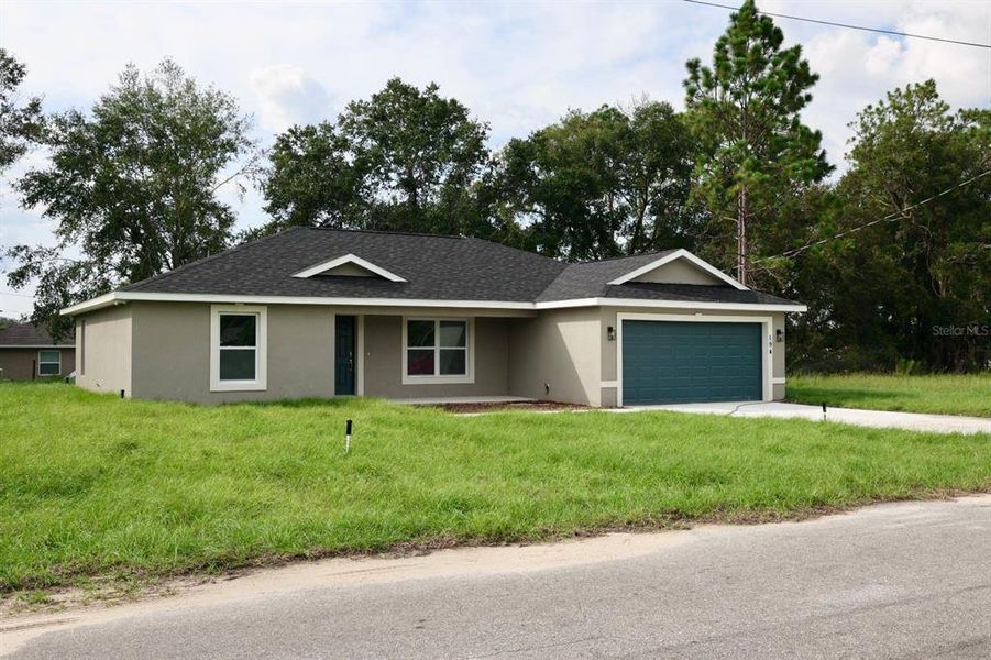 Front exterior of a new home in , Ocklawaha, FL, highlighting curb appeal (Image 13). Front exterior of a new home in , Ocklawaha, FL, highlighting curb appeal (Image 13).