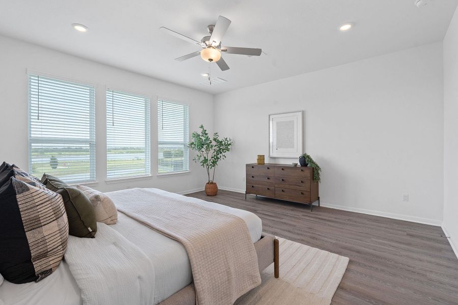 Bedroom featuring wood finished floors, baseboards, a ceiling fan, and recessed lighting