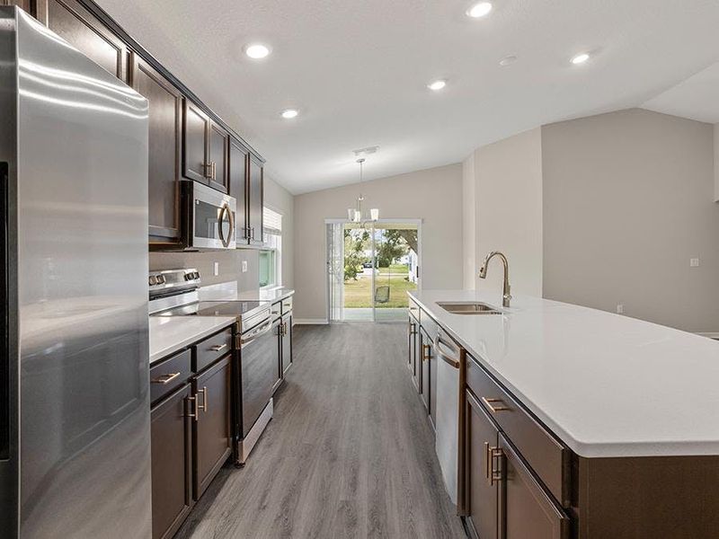 This beautiful, open-layout home includes luxury vinyl plank flooring, quartz countertops, and 36-inch birch wood cabinets.