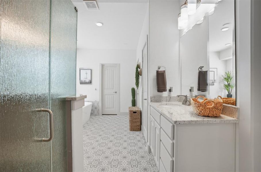 Full bath with vanity, a stall shower, and a freestanding bath Full bath with vanity, a stall shower, and a freestanding bath