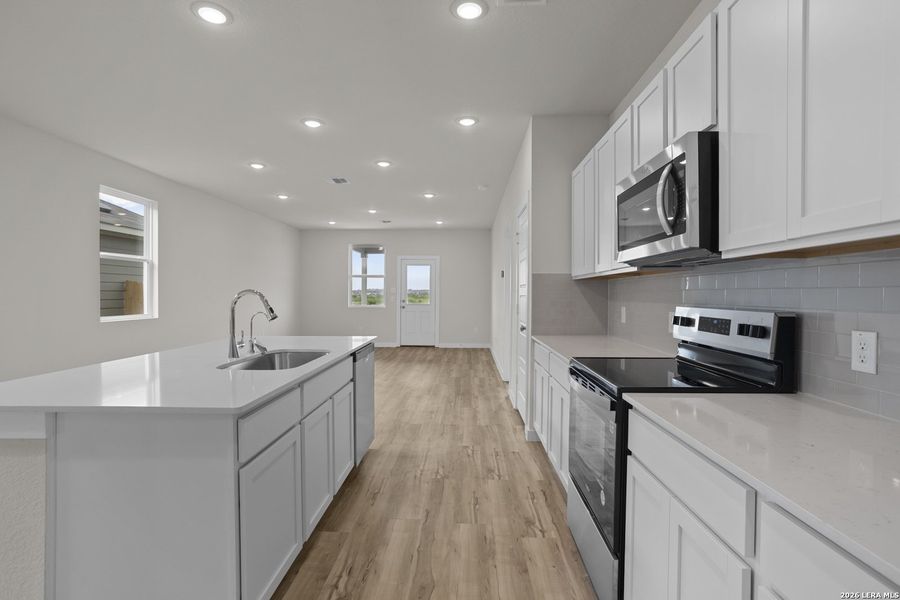Furnished interior view inside a new home in Hacienda, San Antonio (Image 7).