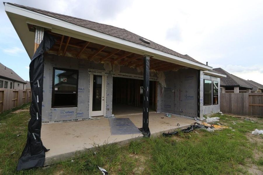 Front exterior of a new home in Riceland 50’ Front Load Homesites, Mont Belvieu, TX, highlighting curb appeal (Image 7).