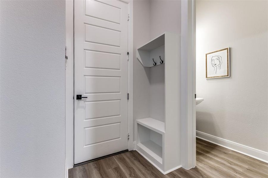 Mudroom with baseboards and dark wood-style floors