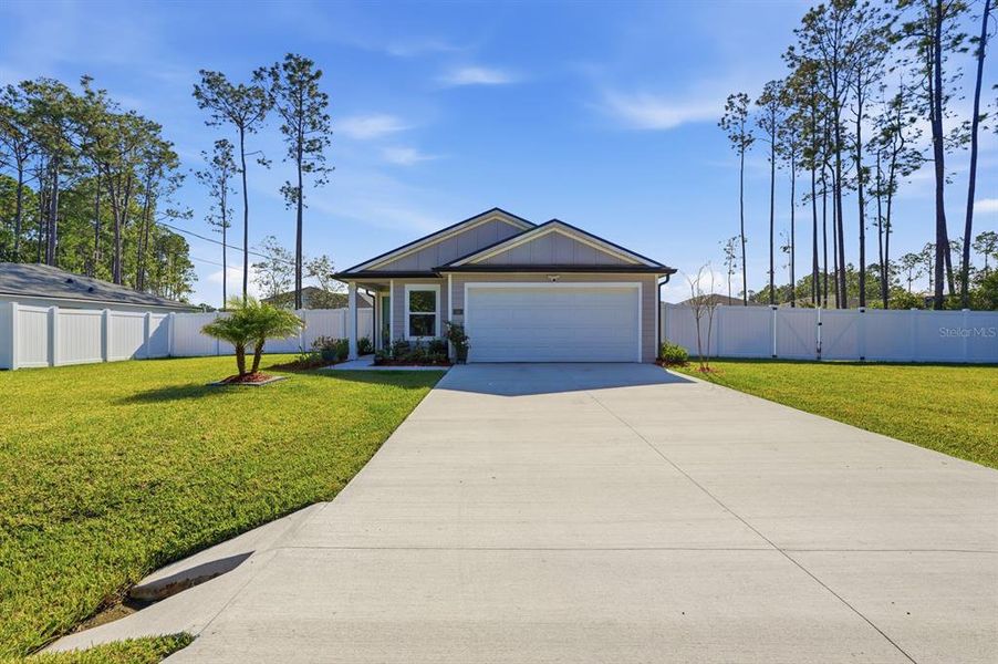 Front exterior of a new home in Palm Coast Homesites, Palm Coast, FL, highlighting curb appeal (Image 23).
