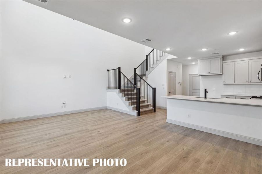 Open metal railing on your new staircase continues the open and airy felling upstairs.  REPRESENTATIVE PHOTO