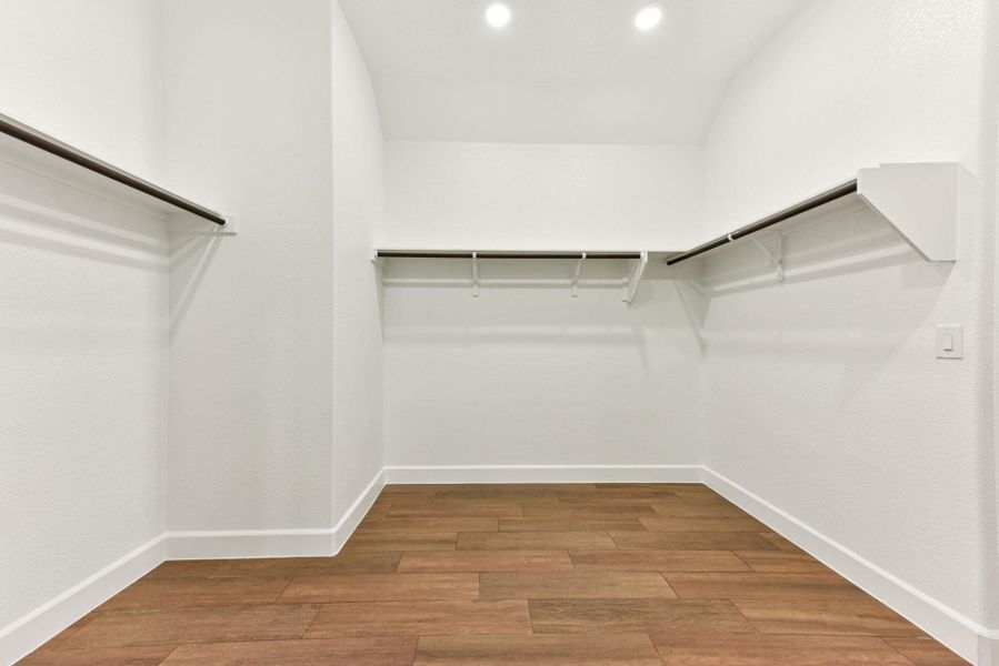Walk in closet featuring light wood-style floors