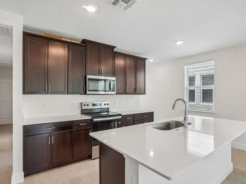 Furnished interior view inside a new home in Villamar - Classic Series, Winter Haven (Image 4).