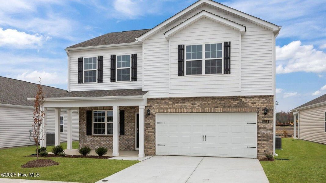 Front exterior of a new home in Ridgewood Farms, Winterville, NC, highlighting curb appeal (Image 17).