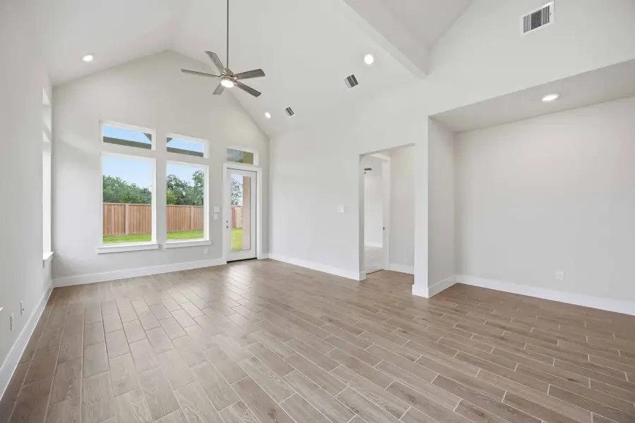 Spacious, unfurnished interior of a new home in Ellwood, Iowa Colony (Image 24).