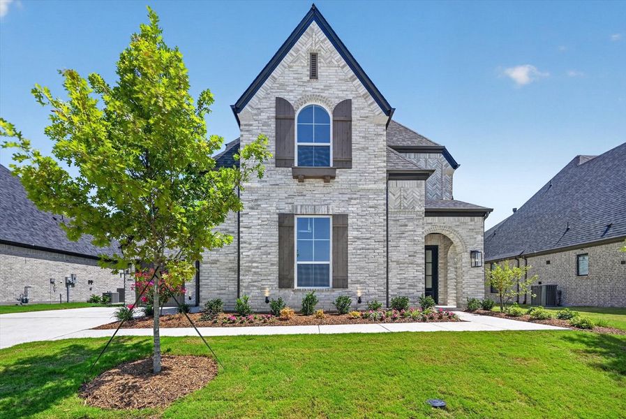Front exterior of a new home in Quail Hollow, Rockwall, TX, highlighting curb appeal (Image 1). Front exterior of a new home in Quail Hollow, Rockwall, TX, highlighting curb appeal (Image 1).