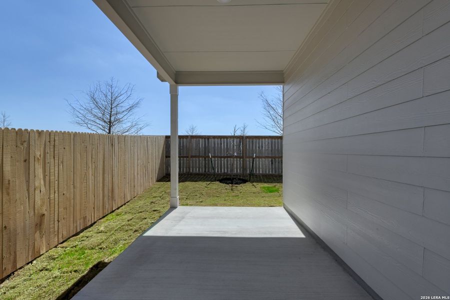 Exterior details and patio area of a home in Hennersby Hollow, San Antonio (Image 3).