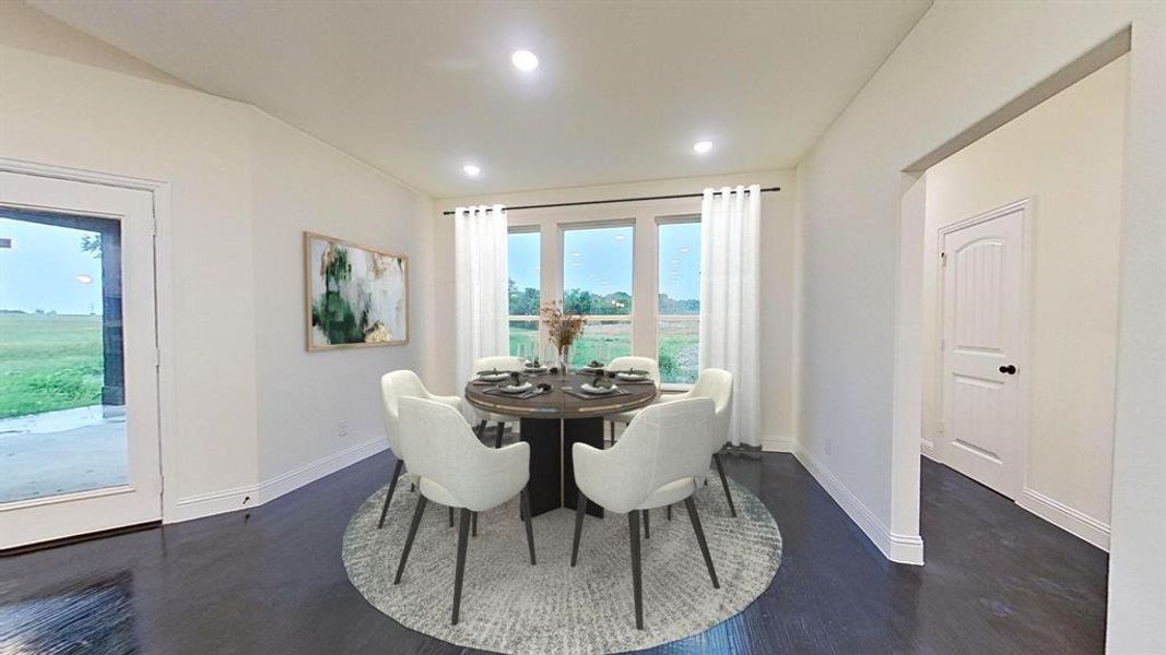 Dining area with recessed lighting and dark wood-type flooring Dining area with recessed lighting and dark wood-type flooring