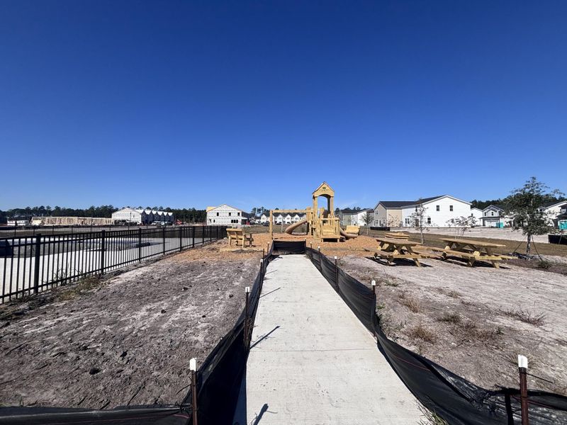 In-progress construction of a new home in Lindera Preserve at Cane Bay Plantation: Townhomes, Summerville, SC (Image 17).