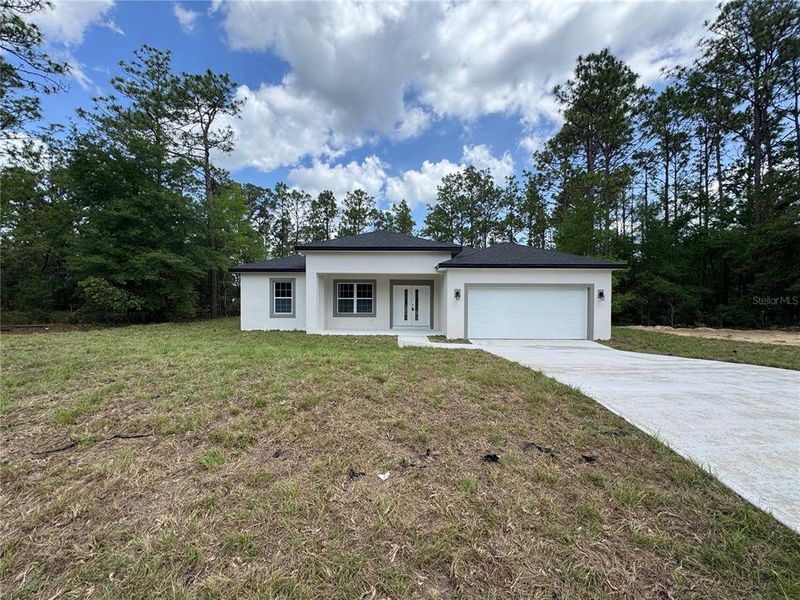Front exterior of a new home in , Citrus Springs, FL, highlighting curb appeal (Image 2).