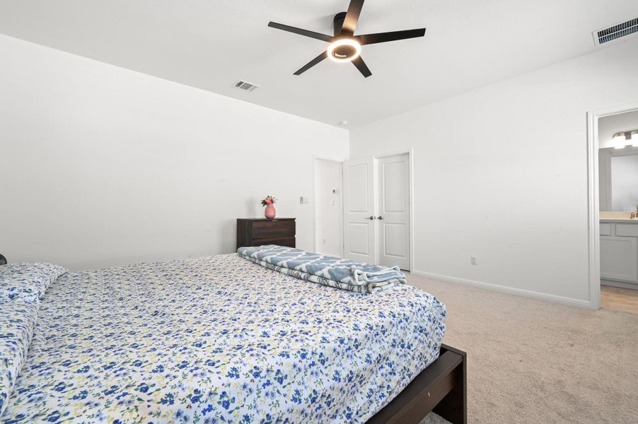 Plush carpeting underfoot complements smooth plaster walls in this comfortable suite.