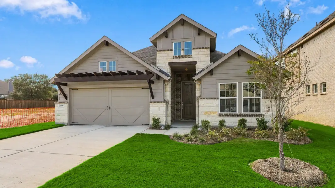 Front exterior of a new home in Taylor Estates, Corinth, TX, highlighting curb appeal (Image 2). Front exterior of a new home in Taylor Estates, Corinth, TX, highlighting curb appeal (Image 2).