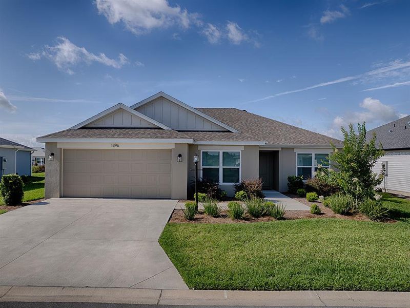 Front exterior of a new home in , The Villages, FL, highlighting curb appeal (Image 16). Front exterior of a new home in , The Villages, FL, highlighting curb appeal (Image 16).